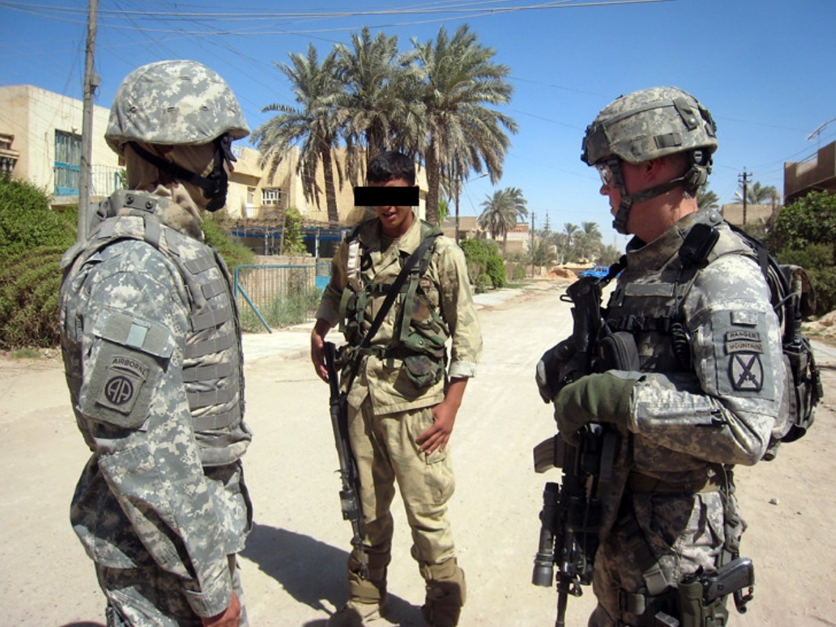 Army recon platoon coordinating on patrol in Baghdad, 2008
